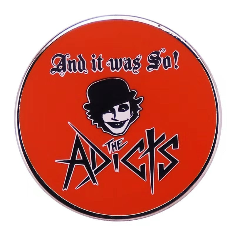 The Adicts Orange Logo Pin Front